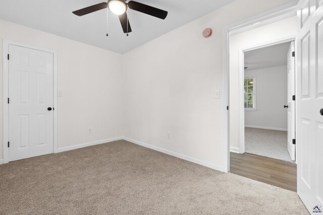 empty room featuring ceiling fan and light wood-type flooring