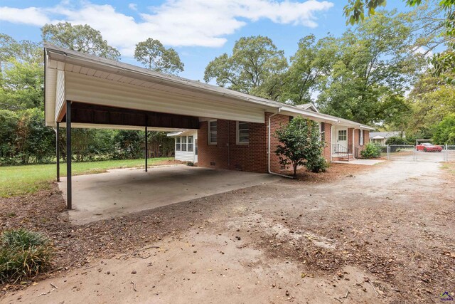 view of car parking featuring a carport