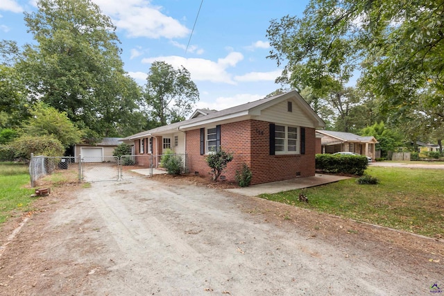 view of front of house with a front yard and a garage