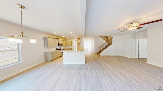 interior space featuring light hardwood / wood-style floors and ceiling fan