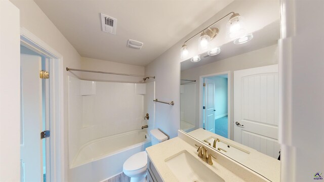 full bathroom with shower / tub combination, vanity, and toilet