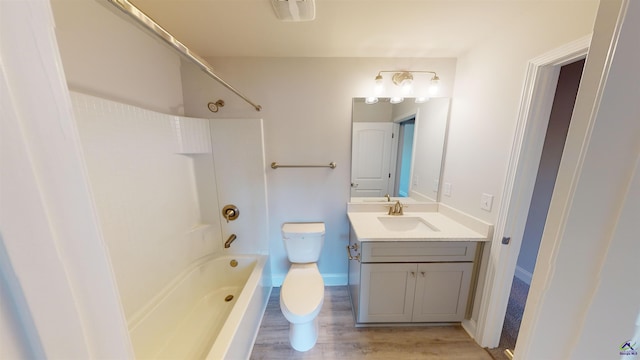 full bathroom with wood-type flooring, vanity, bathtub / shower combination, and toilet