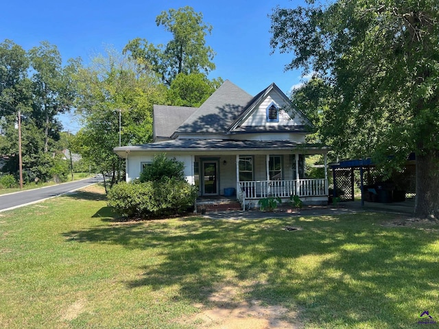 farmhouse with a front yard and a porch