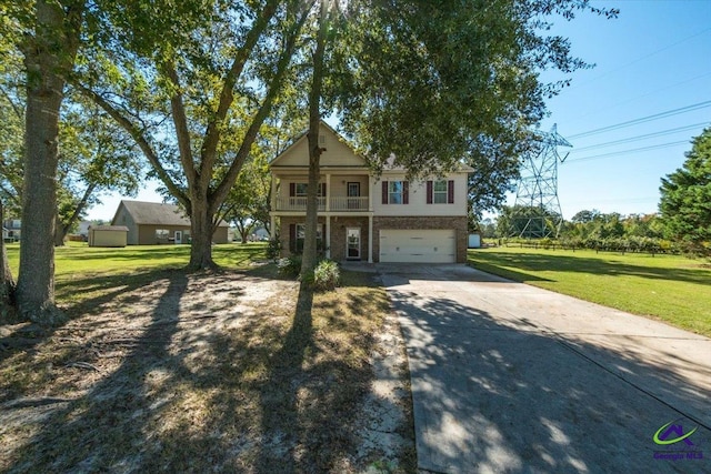 view of front of house with a balcony, a garage, and a front lawn