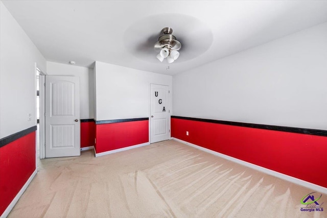 empty room with light carpet and ceiling fan