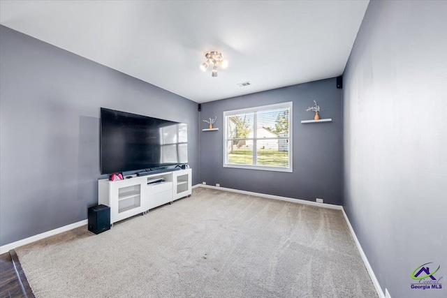 unfurnished living room with carpet floors