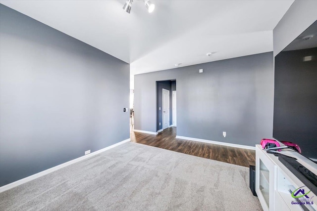 spare room with dark hardwood / wood-style floors