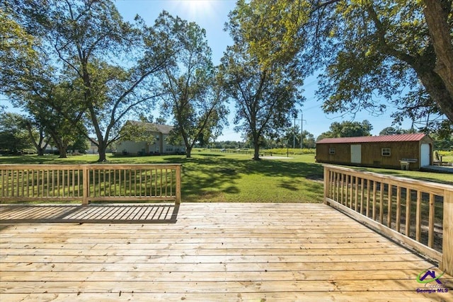 wooden terrace with a yard