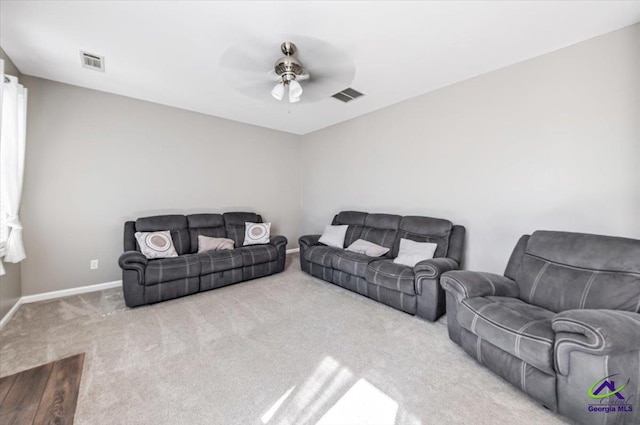 living room featuring ceiling fan and carpet floors