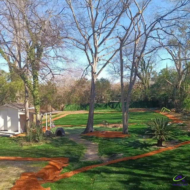 view of property's community with a yard