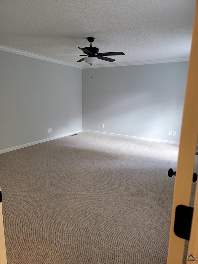 carpeted empty room with crown molding, baseboards, a ceiling fan, and a textured ceiling