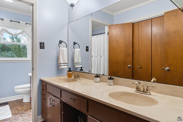 bathroom with vanity, crown molding, toilet, and tile patterned floors