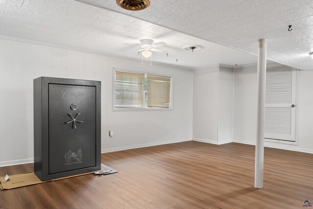 interior space with ceiling fan, a textured ceiling, crown molding, and hardwood / wood-style floors