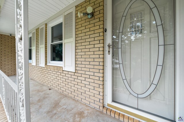 doorway to property featuring a porch