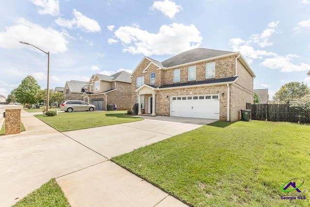 view of front of property featuring a garage and a front lawn