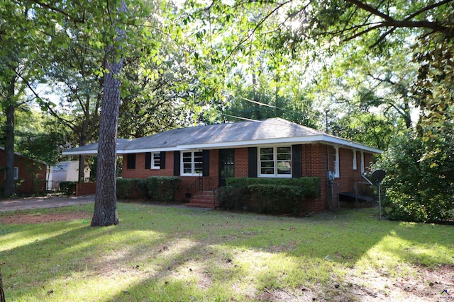 single story home with brick siding and a front lawn