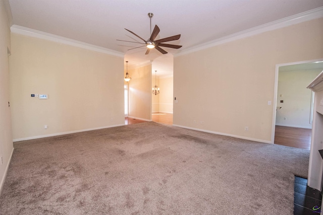 carpeted empty room featuring crown molding and ceiling fan