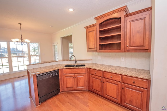 kitchen with an inviting chandelier, sink, light hardwood / wood-style flooring, black dishwasher, and kitchen peninsula