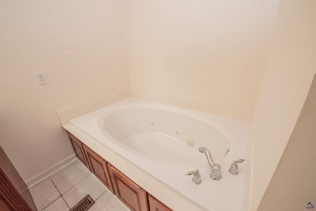 bathroom with tile patterned floors and a bathtub