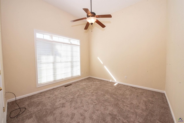 carpeted empty room featuring ceiling fan