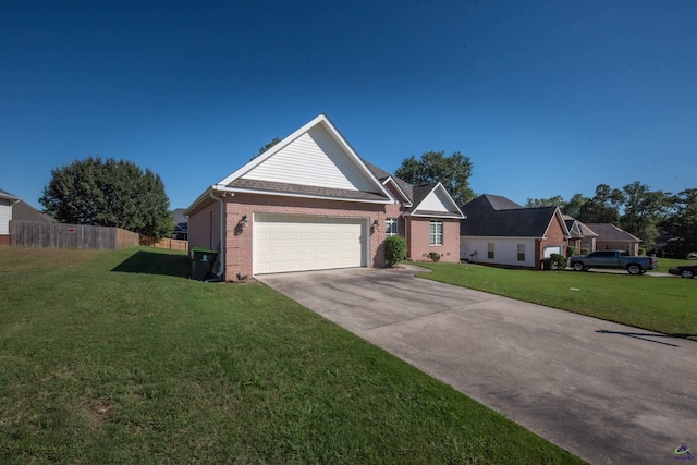 view of front of home with a front lawn and a garage