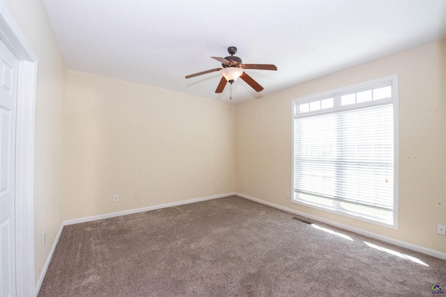 unfurnished room featuring carpet flooring and ceiling fan