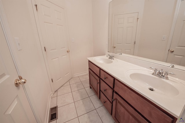 bathroom featuring tile patterned flooring and vanity