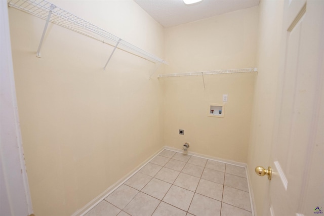 laundry room featuring washer hookup, light tile patterned floors, and electric dryer hookup