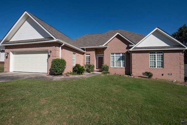 view of front of property featuring a front lawn and a garage