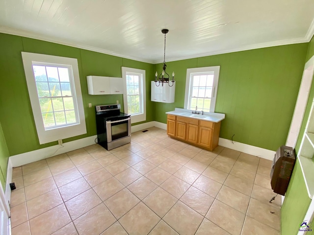 kitchen featuring electric stove, hanging light fixtures, plenty of natural light, and an inviting chandelier