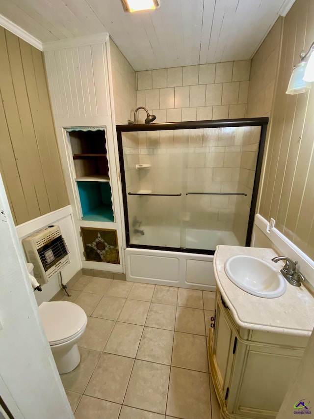 full bathroom with enclosed tub / shower combo, vanity, toilet, wooden walls, and tile patterned flooring