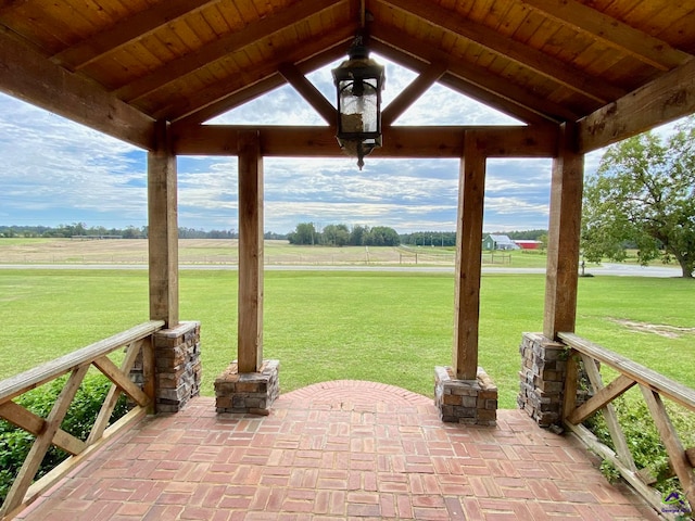 view of patio with a gazebo and a rural view