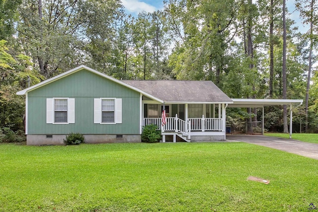 view of front of home with a front yard, a porch, and a carport