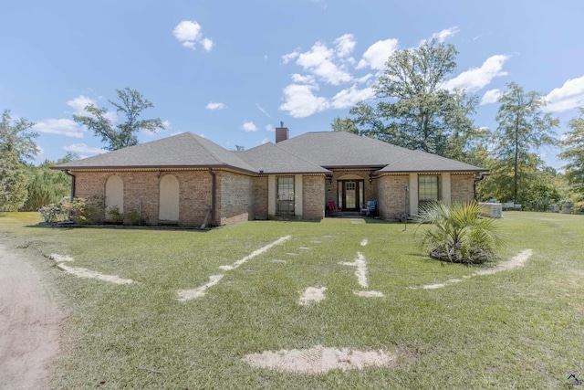 ranch-style house featuring a front lawn