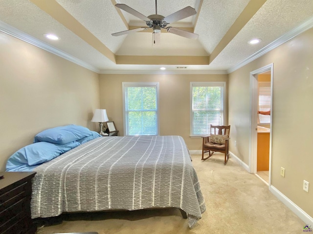 carpeted bedroom featuring a textured ceiling, crown molding, ceiling fan, and a raised ceiling