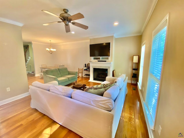 living room featuring light hardwood / wood-style flooring and ornamental molding