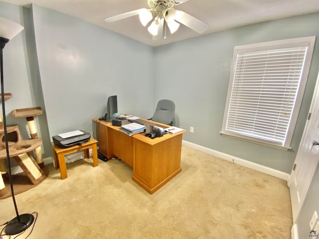 office area featuring ceiling fan and light colored carpet