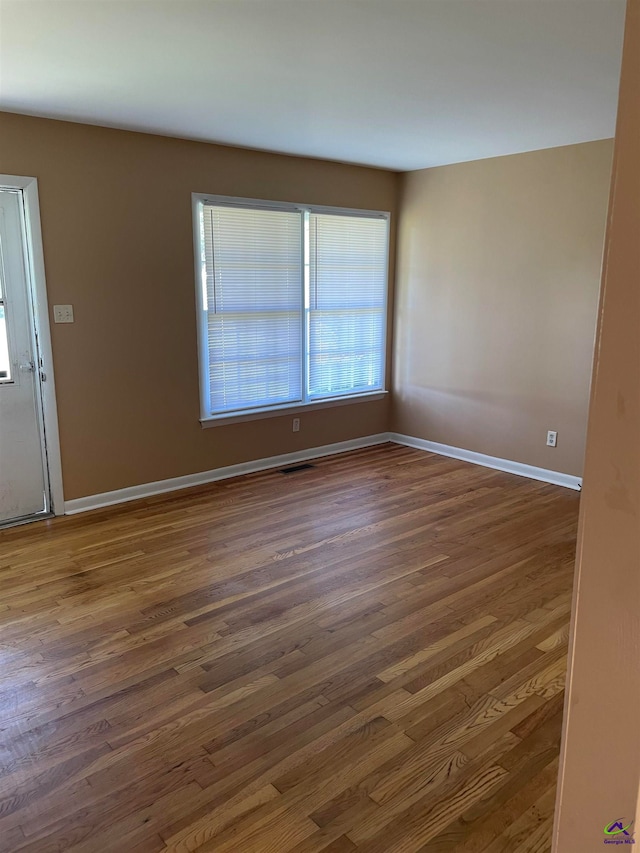 empty room featuring dark hardwood / wood-style floors