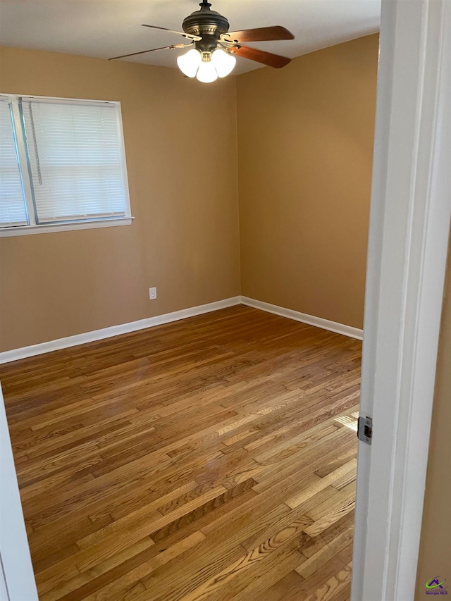 spare room featuring ceiling fan and light hardwood / wood-style floors