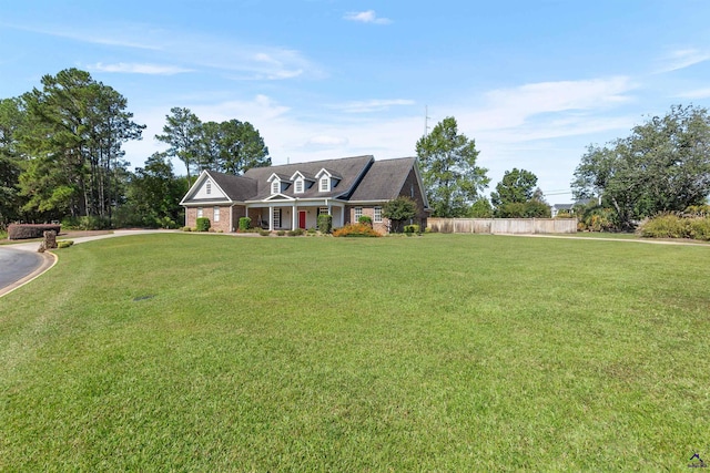 new england style home with a front lawn