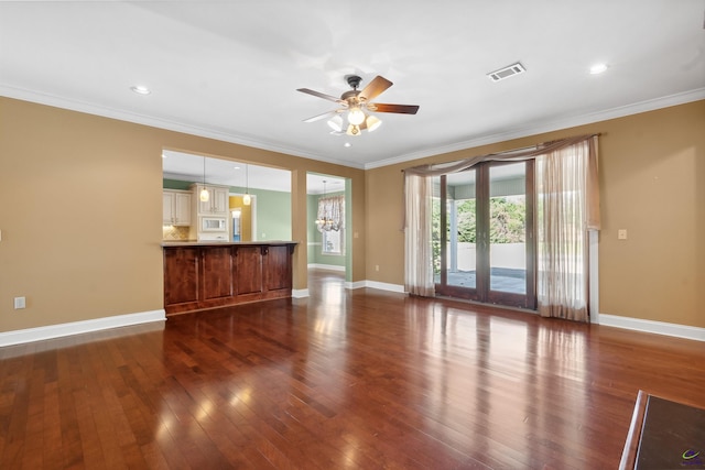 unfurnished living room featuring dark hardwood / wood-style floors, crown molding, and ceiling fan