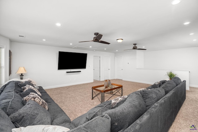 living room with ceiling fan and carpet floors