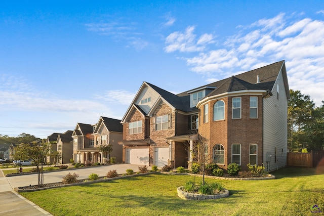 view of front of house with a garage and a front yard