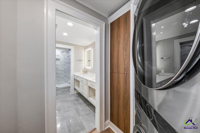 laundry area with ornamental molding