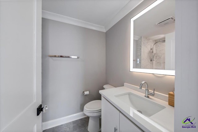 bathroom with ornamental molding, a tile shower, vanity, and toilet