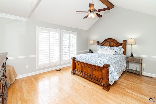 bedroom featuring ceiling fan, vaulted ceiling with beams, and light wood-type flooring