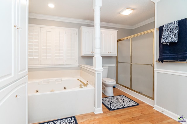 bathroom featuring separate shower and tub, ornamental molding, wood-type flooring, a textured ceiling, and toilet