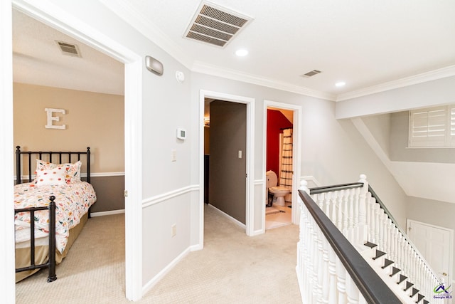 hall featuring light colored carpet and ornamental molding