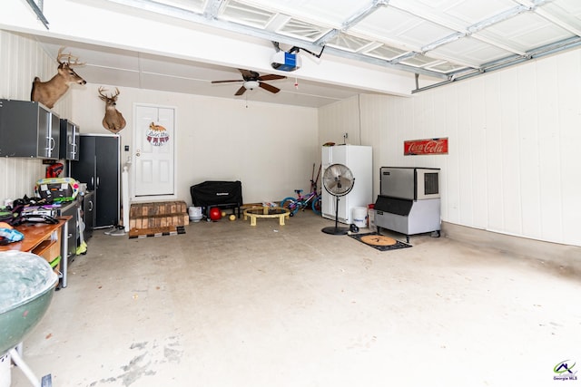 garage featuring ceiling fan and a garage door opener