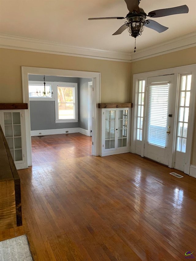 interior space featuring ceiling fan, crown molding, and hardwood / wood-style floors